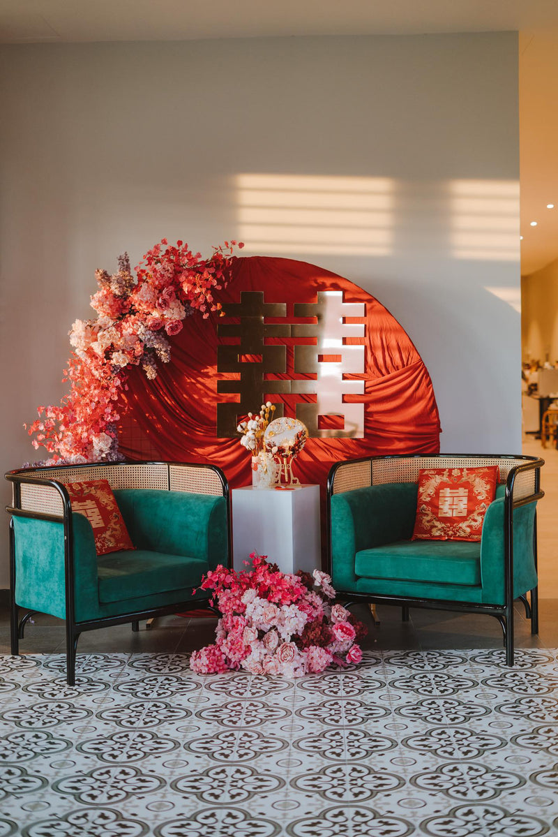 Hot pink wedding decoration with a floral backdrop