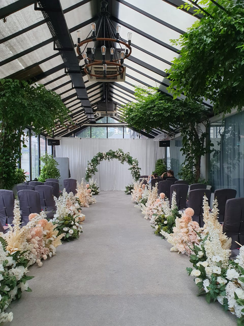 Garden wedding decoration with natural greenery and flowers