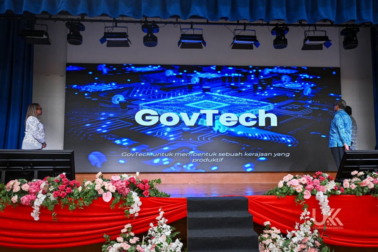 Wide floral stage styling at the Malaysia GovTech Flagship Report launch