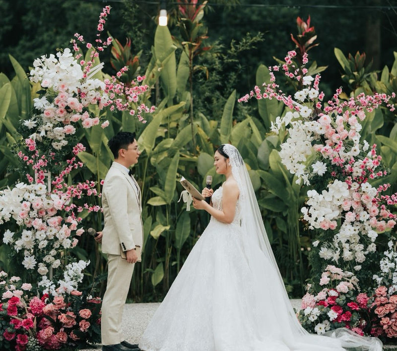 Outdoor garden wedding ceremony with soft pink and white floral décor at Sumsum Garden