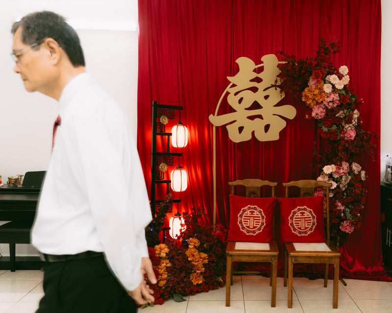 Red curtain Chinese tea ceremony seating with lanterns, floral details and double happiness styling